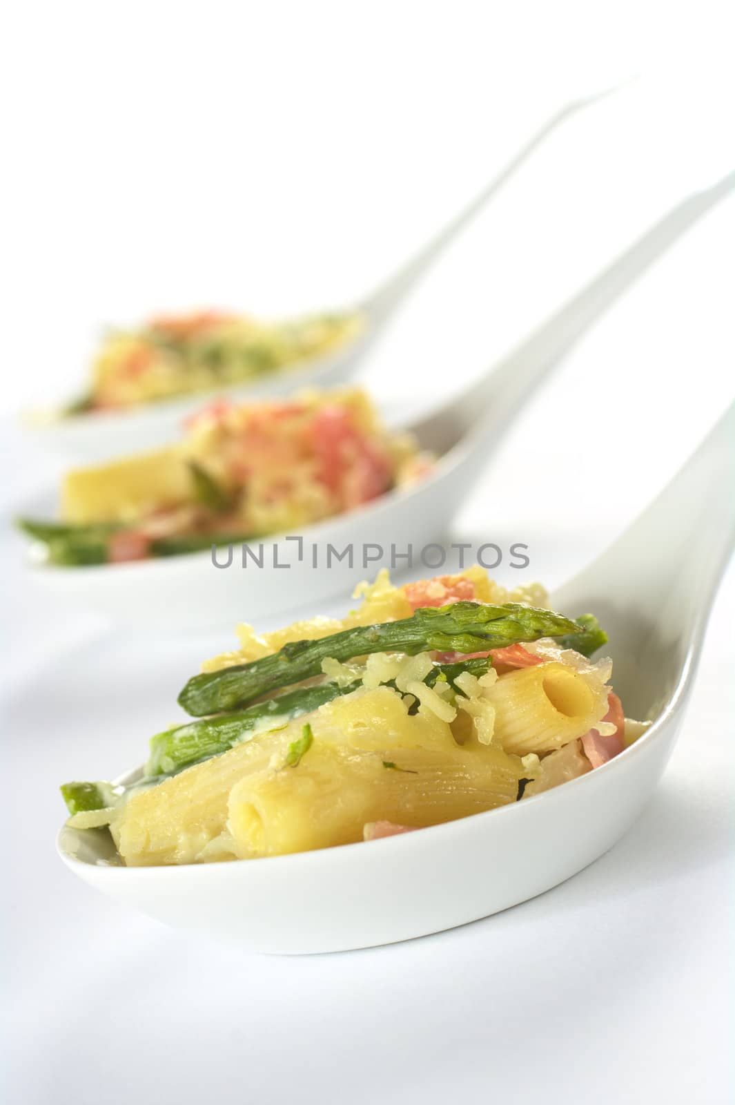 Green asparagus, ham and pasta casserole (Selective Focus, Focus on the asparagus head in the front)