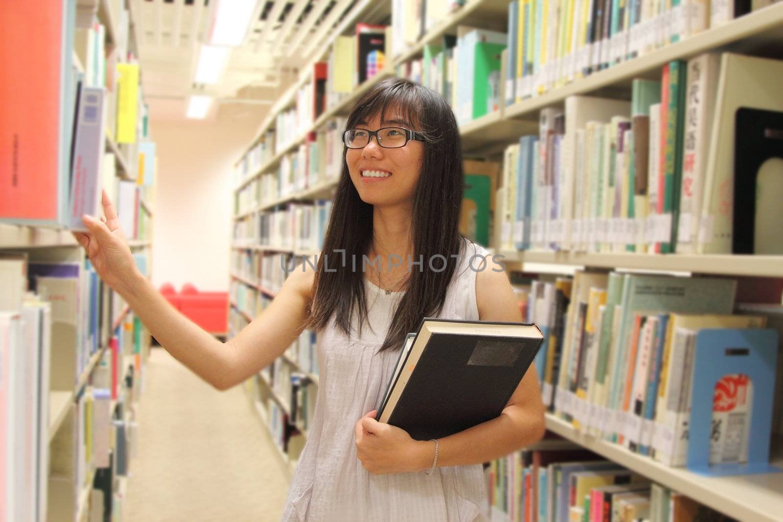 Young college student in library