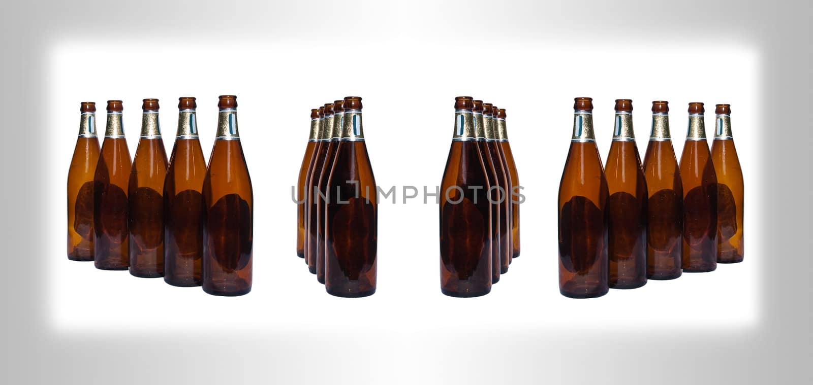 Empty beer bottles isolated over white background