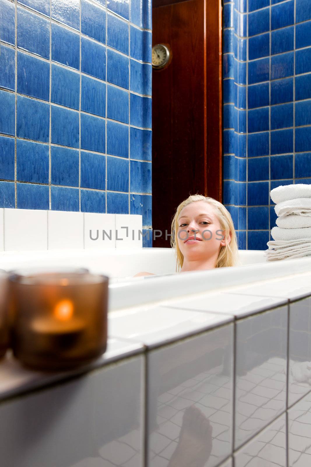 A beautiful blond caucasian female in a 1920's style bath and spa