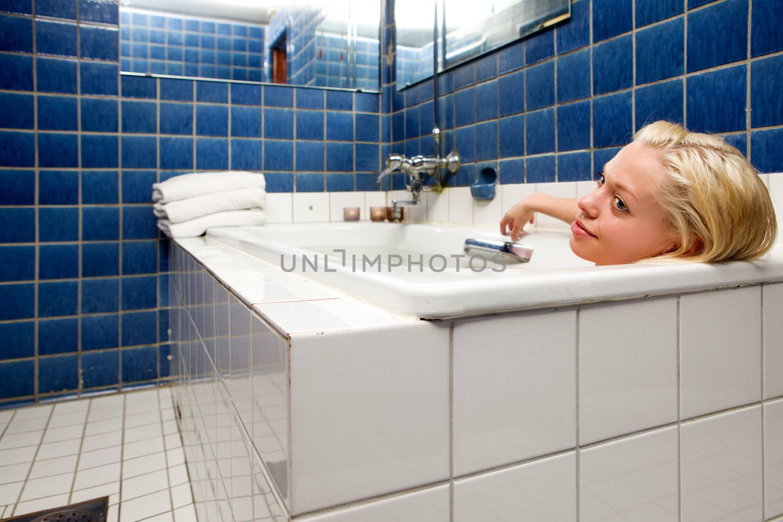 Woman in Bathtub in Blue Room by leaf