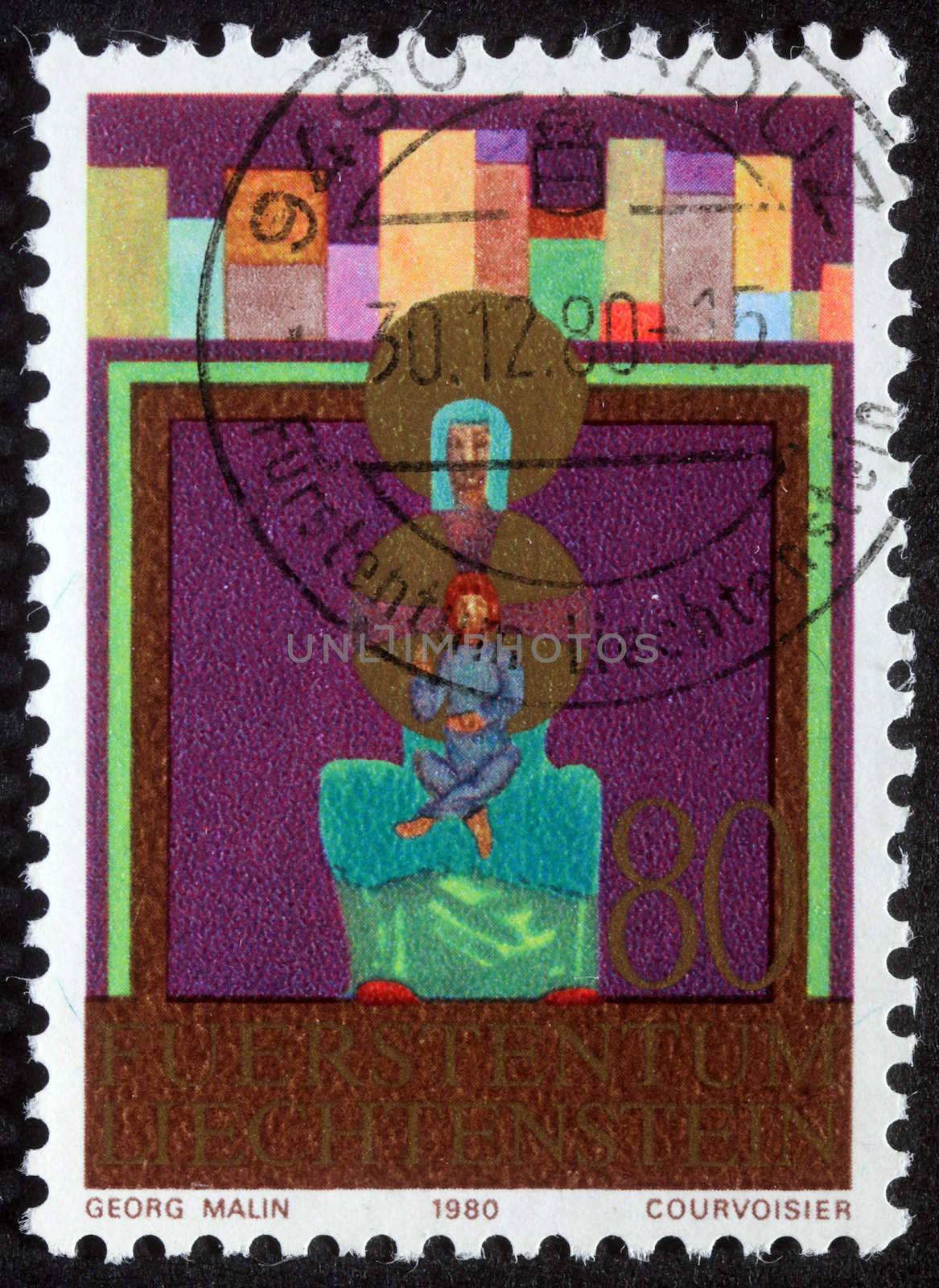 LIECHTENSTEIN - CIRCA 1980: A greeting Christmas stamp printed in Liechtenstein shows Madonna and Child