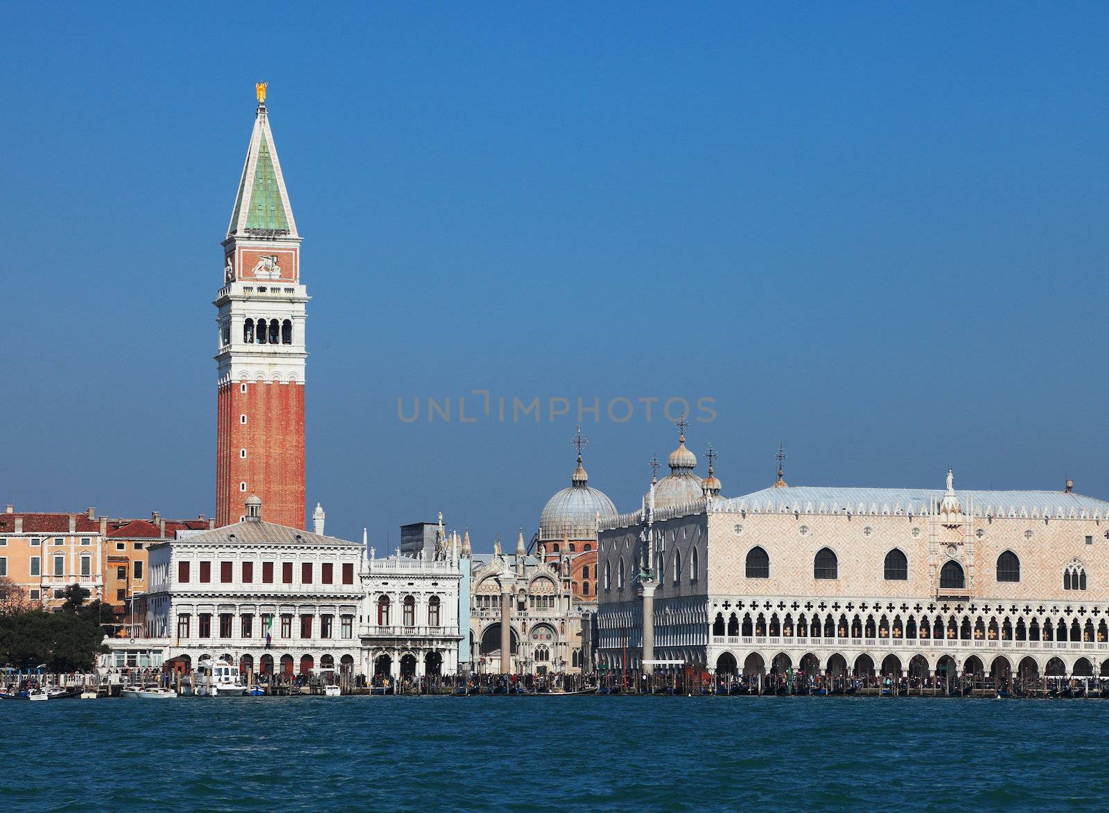 View of buildings from St. Mark (San Marco) square in Venice seen from the Venetian Lagoon. In the first plane you can see at the left The St.Mark's Campanille and at the right the Doge's Palace.