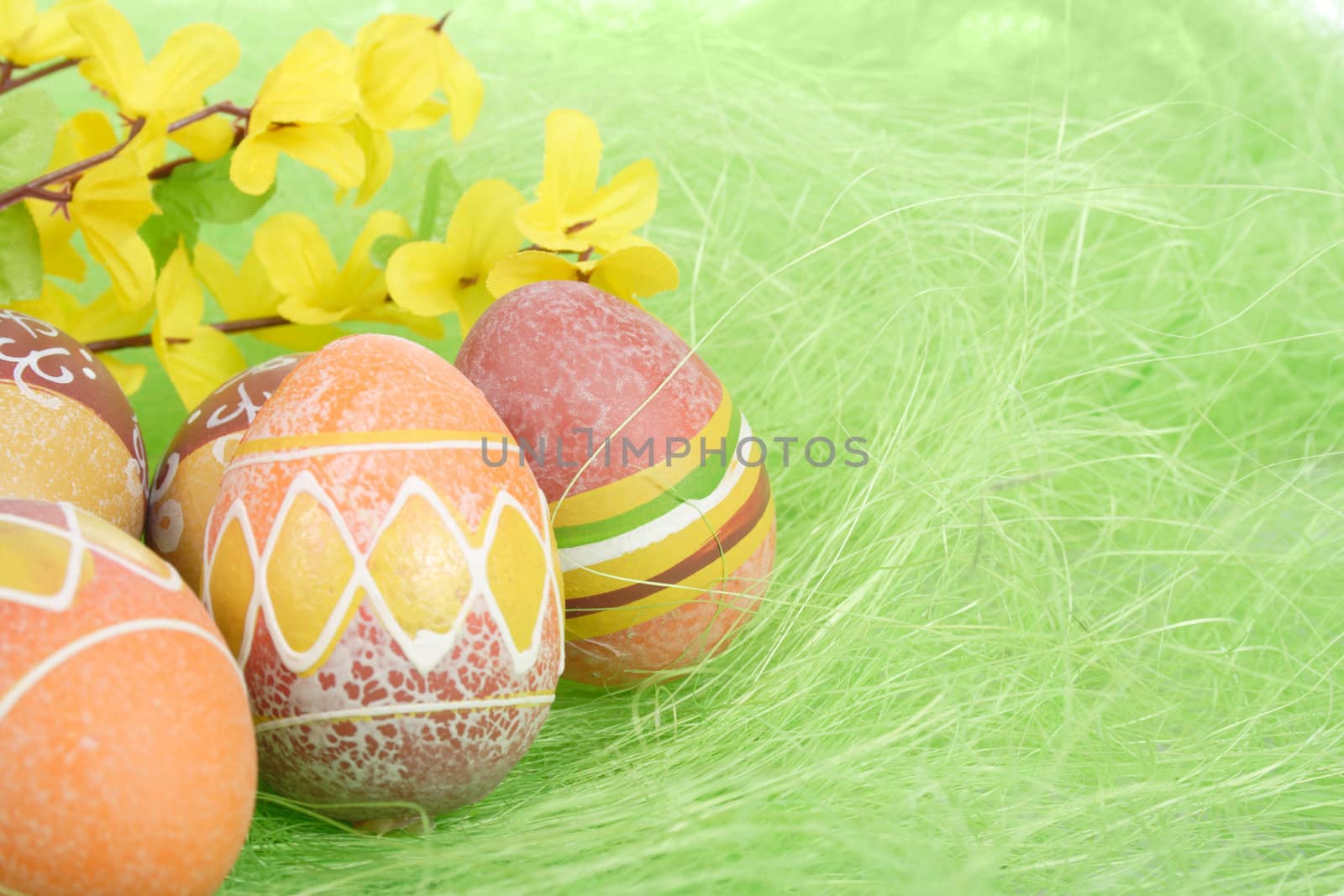 Painted Colorful Easter Eggs on green Grass