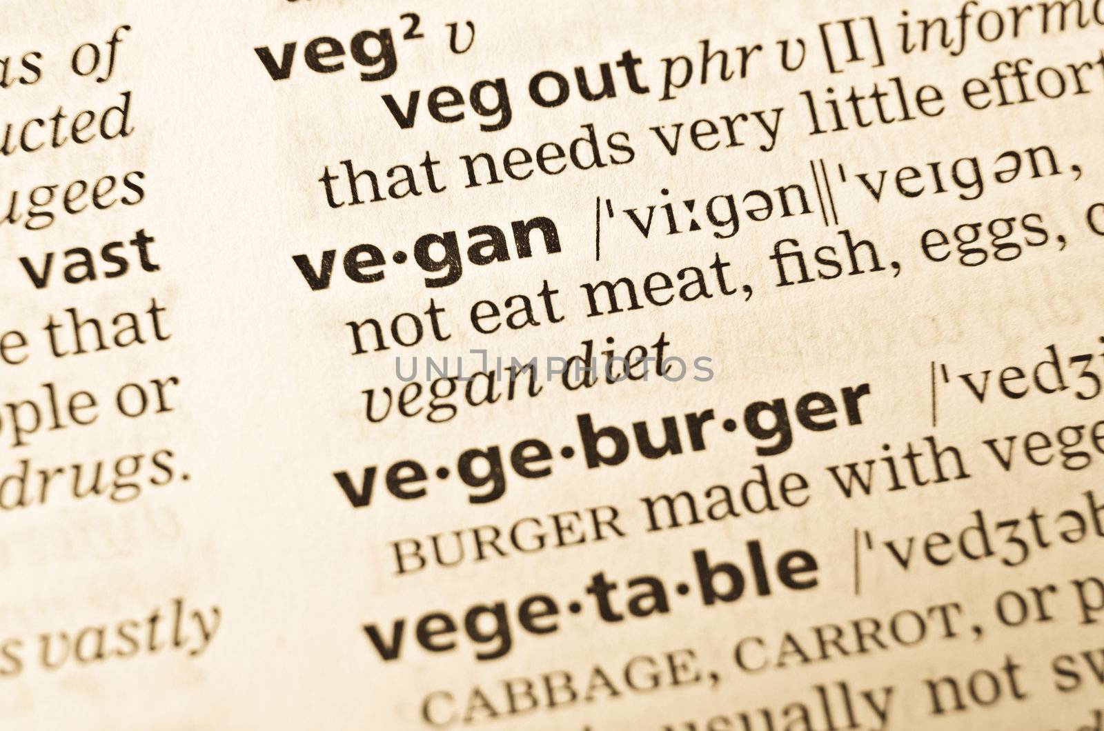 The word vegan in the old dictionary. Selective focus effect.