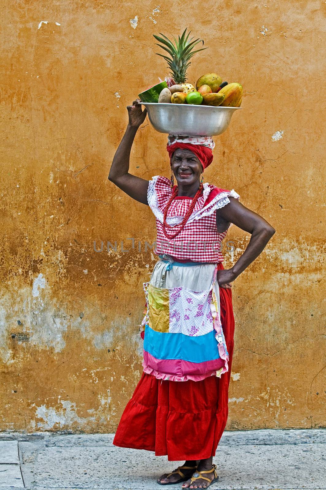 CARTAGENA DE INDIAS , COLOMBIA - DEC 21:Unidentified Palenquera woman sell fruts in Cartagena de Indias on December 21 2010,Palenqueras are  a unique African descendat ethnic group found in the north region of South America