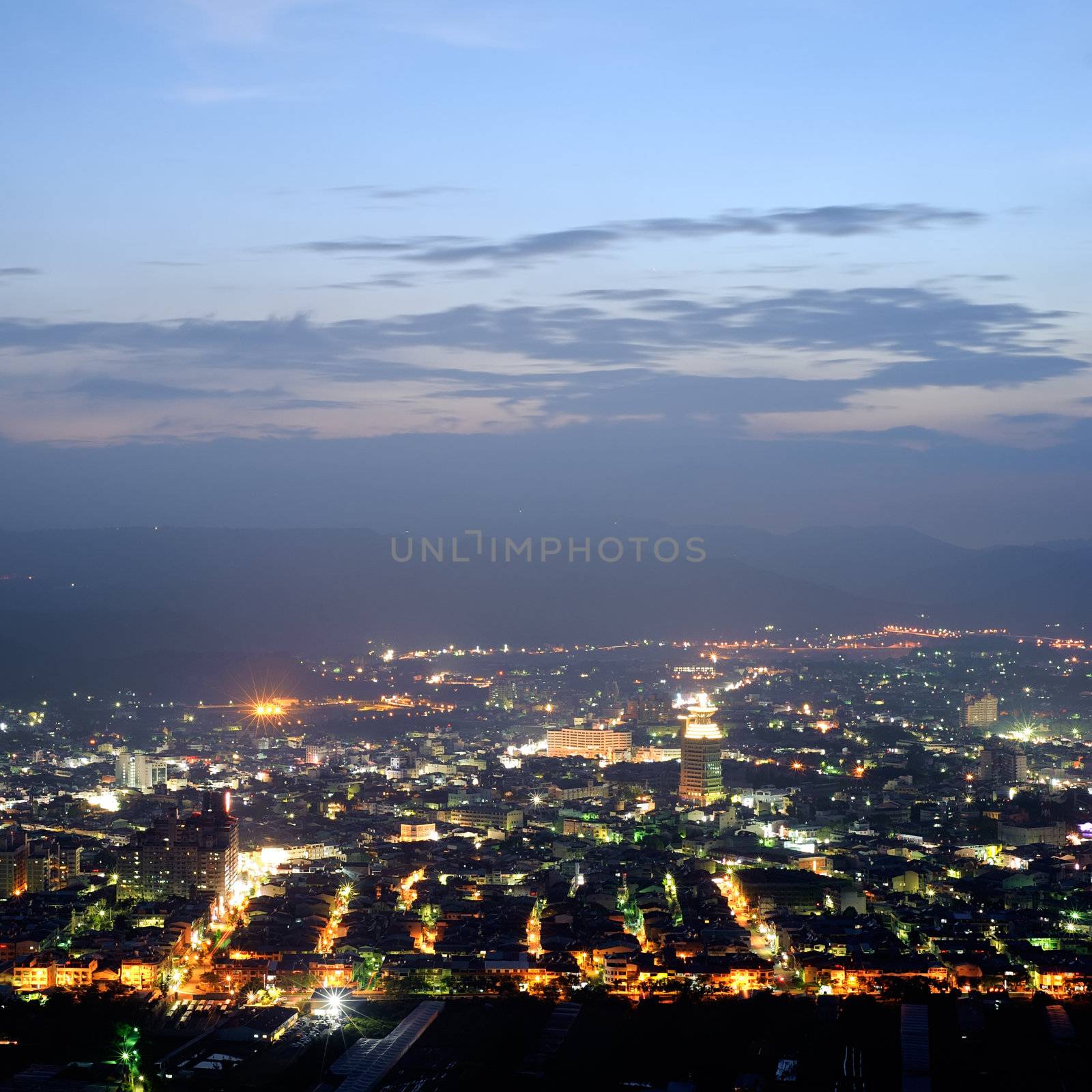 Cityscape of night scenery with houses and buildings under blue sky in Puli township, Nantou County, Taiwan, Asia.