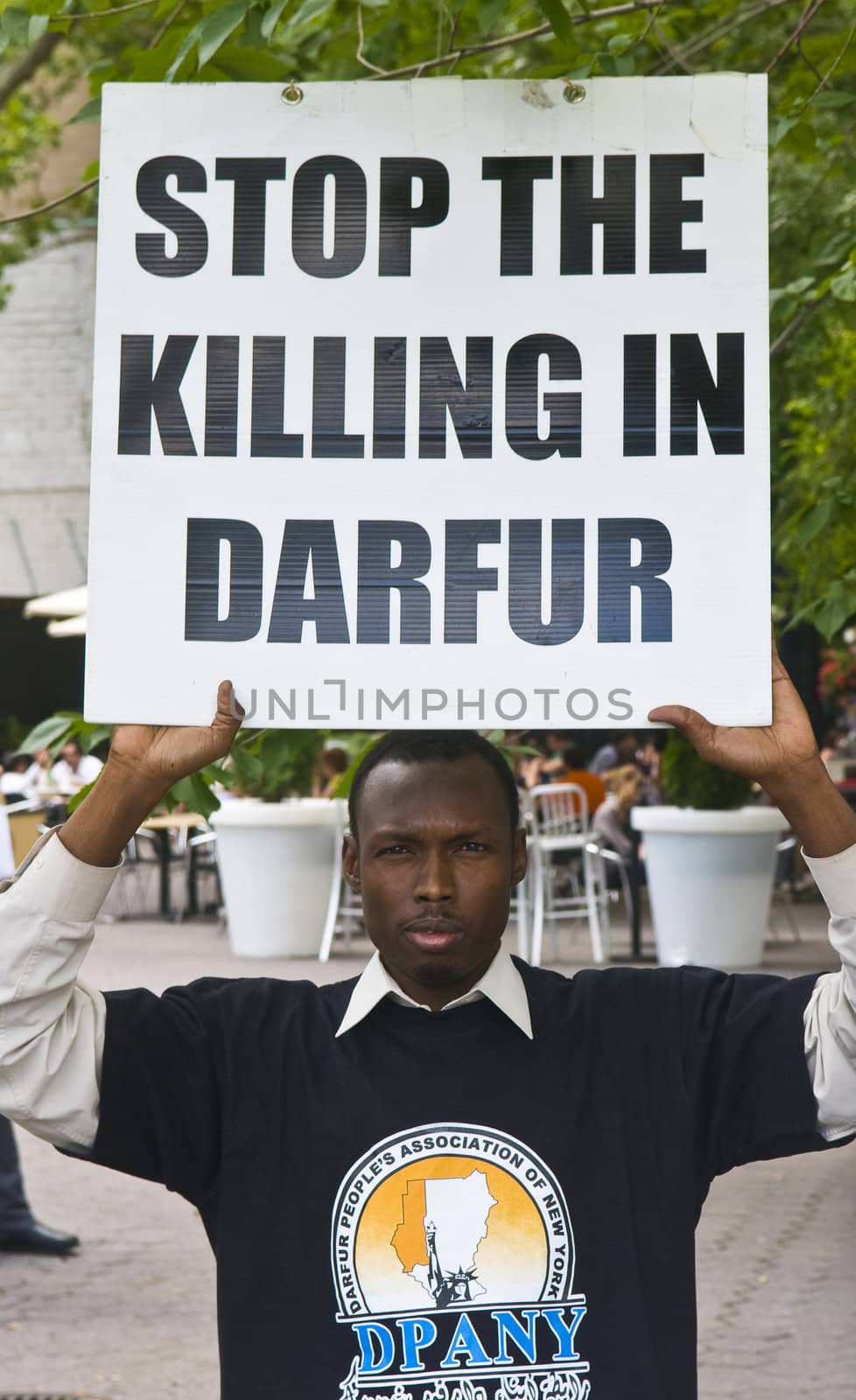 NEW YORK -  JUNE 27 2011 : Unitentified participant in a demonstration against the government of Sudan in front of the UN offices in New York city on June 27 2011