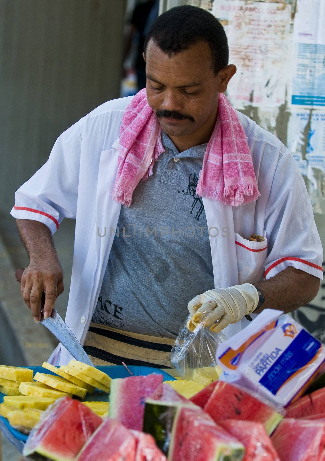 CARTAGENA DE INDIAS , COLOMBIA - DEC 16:Unidentified colombian man sell fruits in the street in Cartagena de Indias on December 16 2010