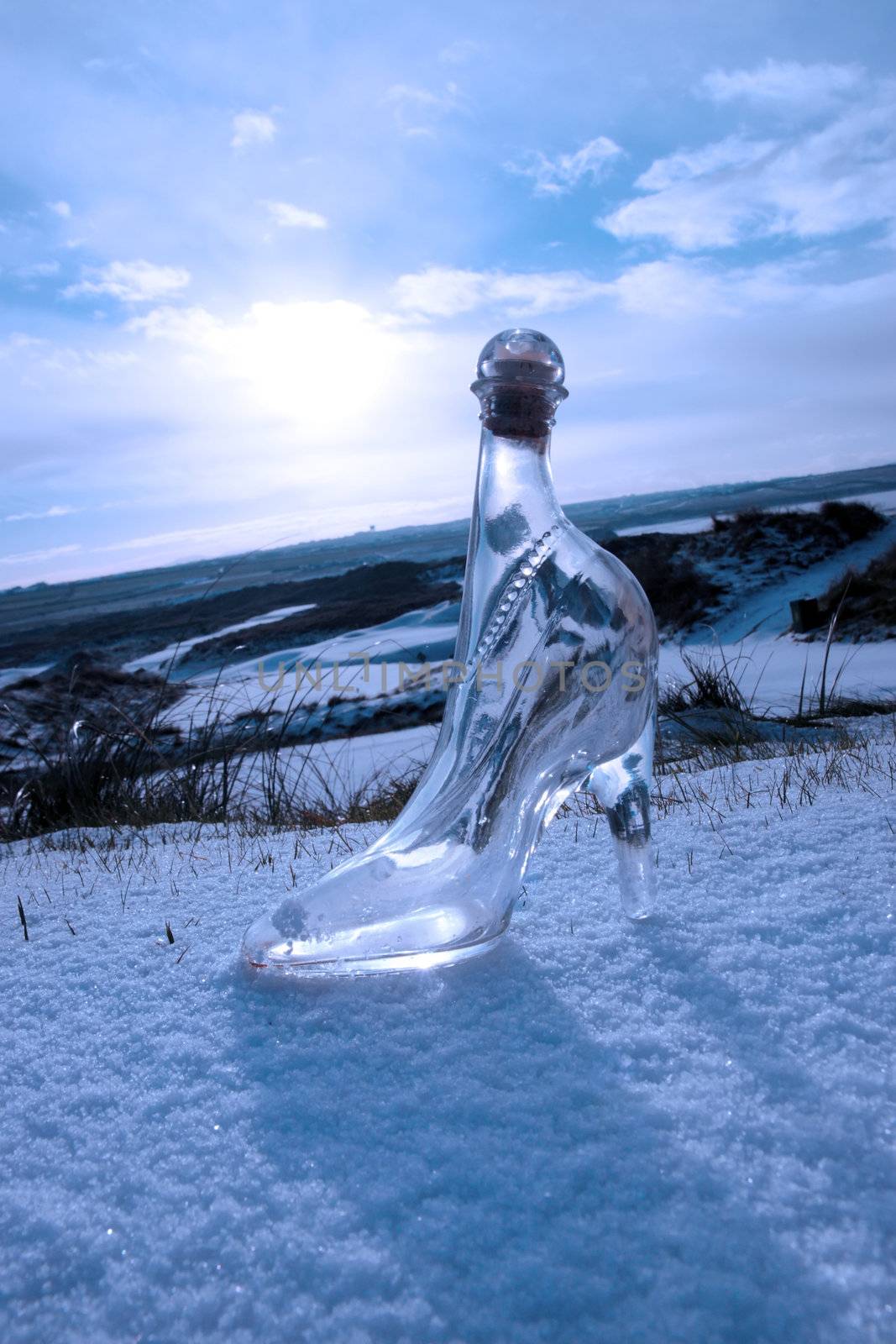 crystal glass high heels on blue snowy golf course by morrbyte