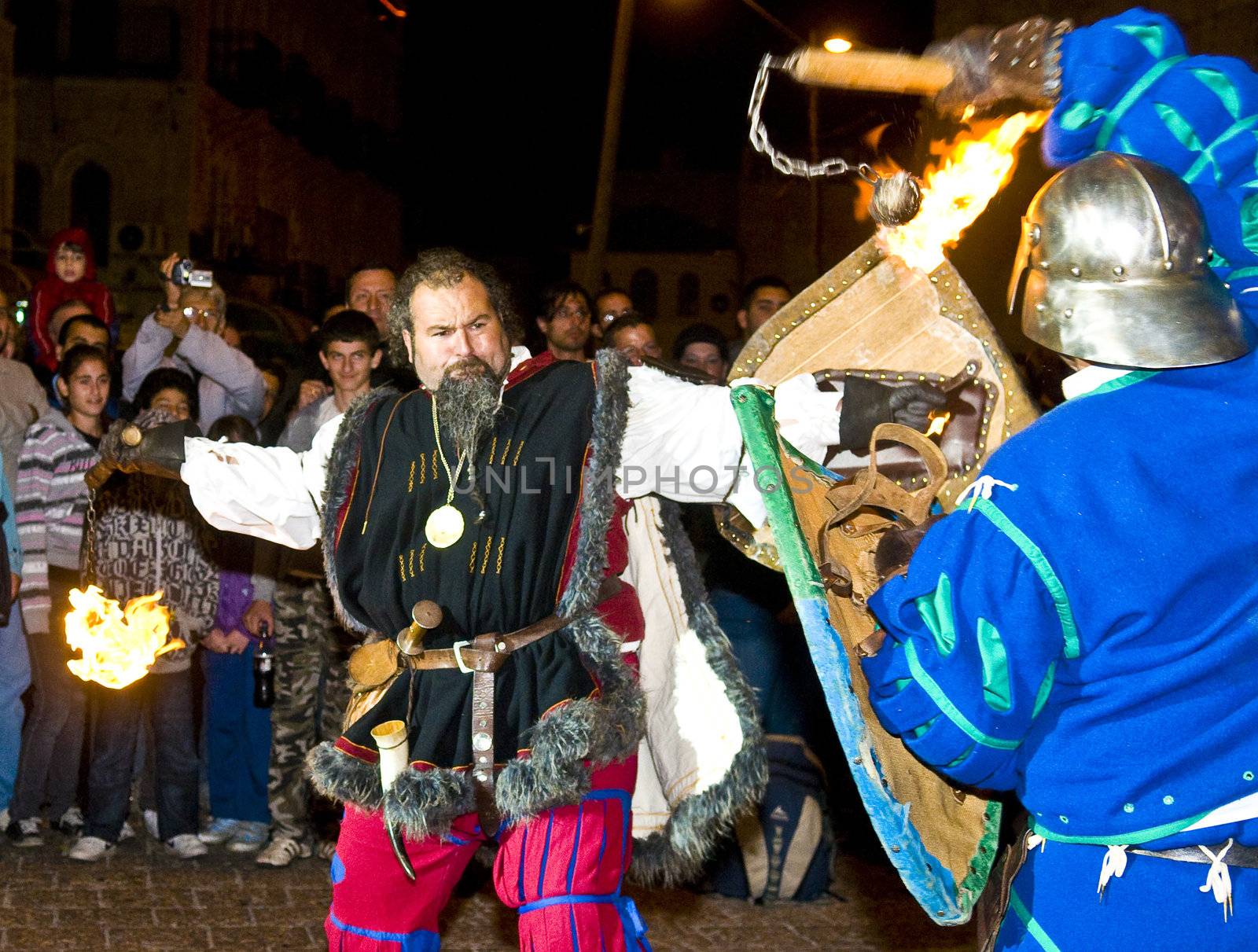 JERUSALEM - NOV 03 : An Italian actors dresses as knight fight with sword and fire in the annual medieval style knight festival held in the old city of Jerusalem on November 03 2011