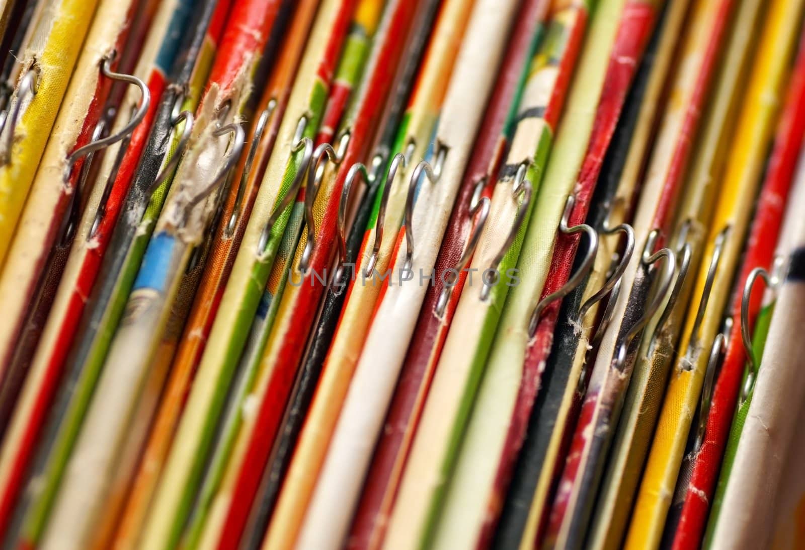 various colorful magazines covers on bookshelf closeup
