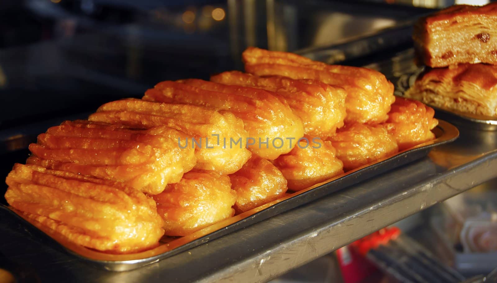 traditional turkish and greek dessert tulumba on metallic tray