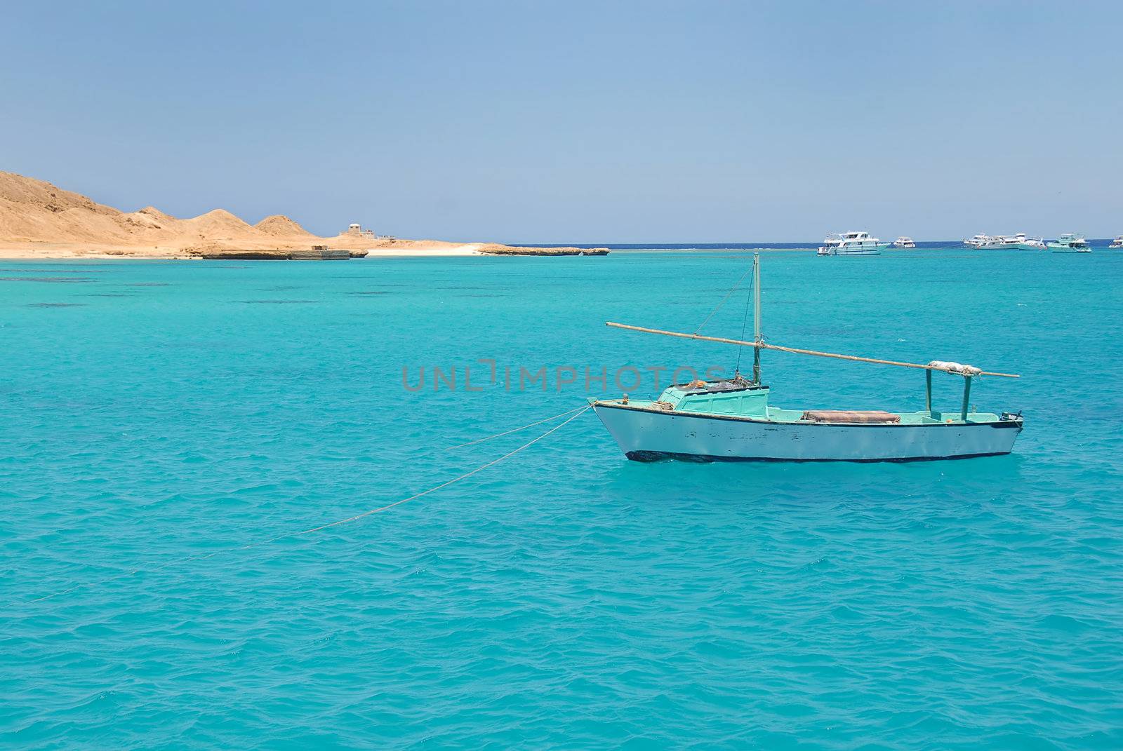 boats on turquoise water of Red Sea, Egypt