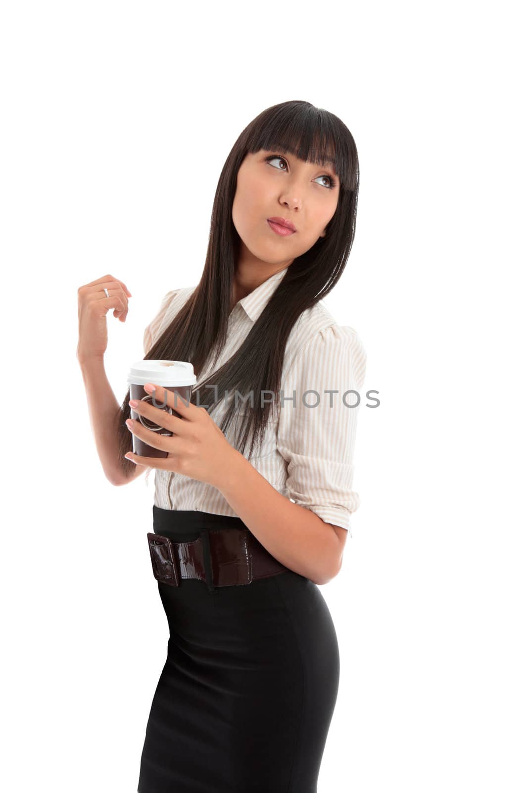 Smart dressed business woman holding a coffee and looking over her shoulder.   Space for copy.   White background.