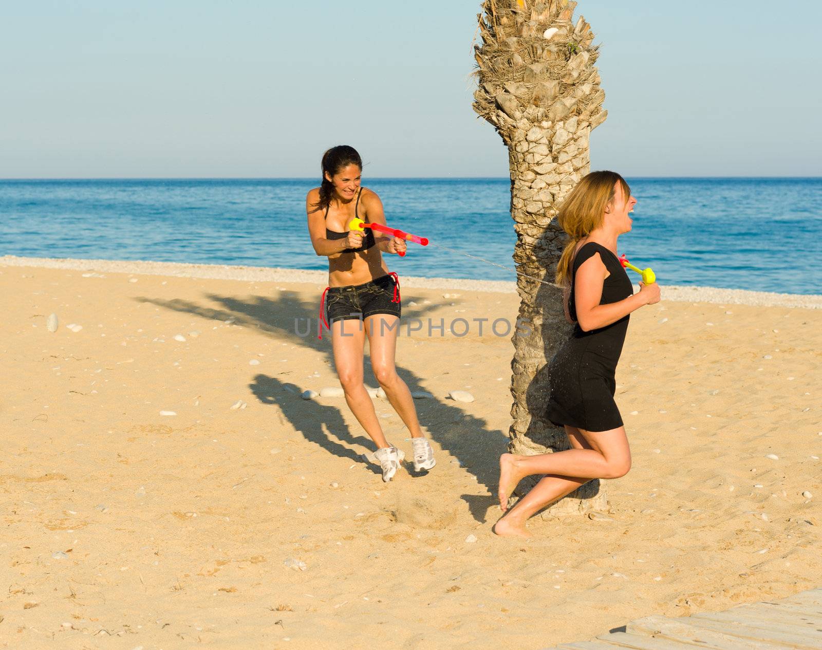 Girls in an intense water pistol fight