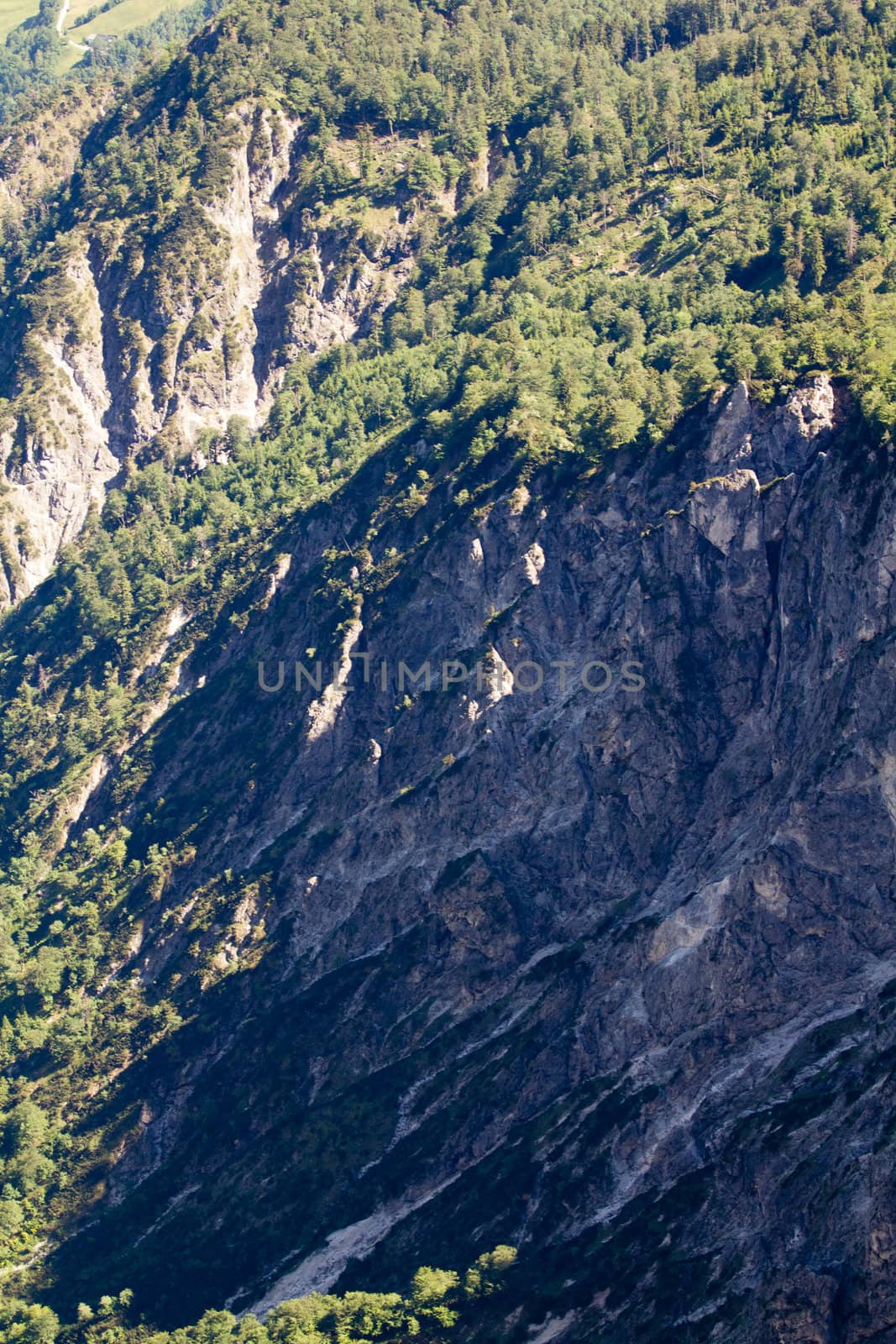 The Alpine mountains of Austria below the warm sun of summer