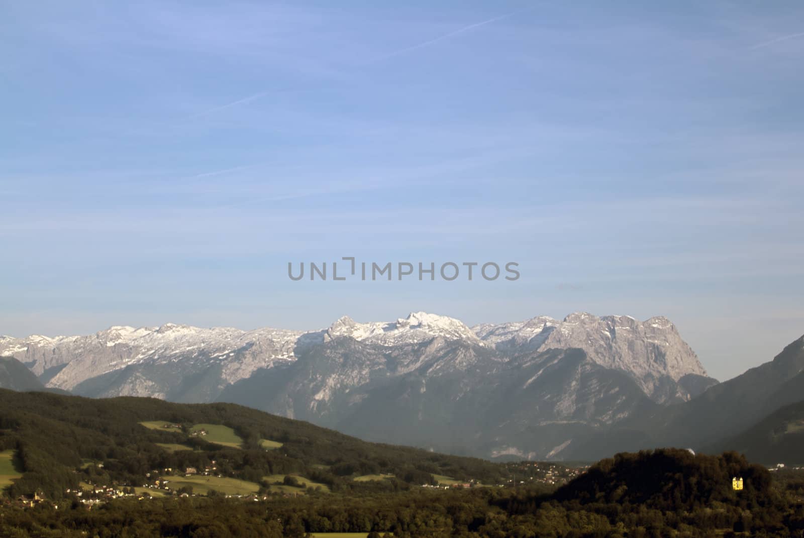 The Alpine mountains of Austria below the warm sun of summer