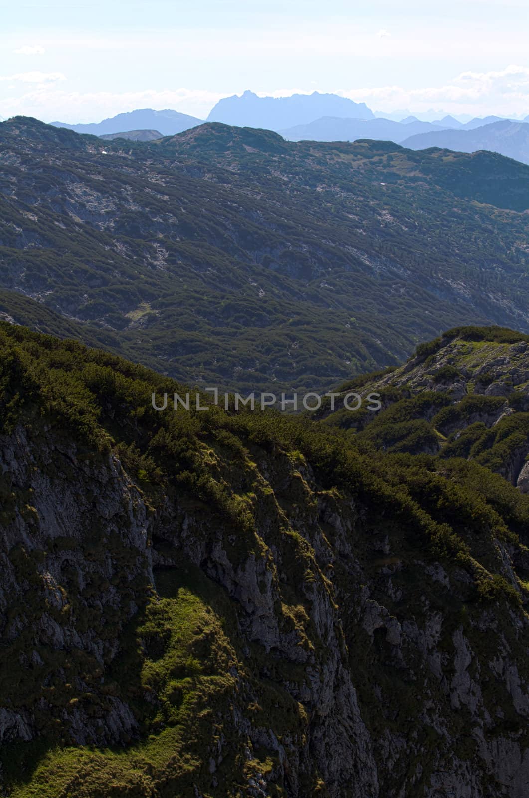 The Alpine mountains of Austria below the warm sun of summer