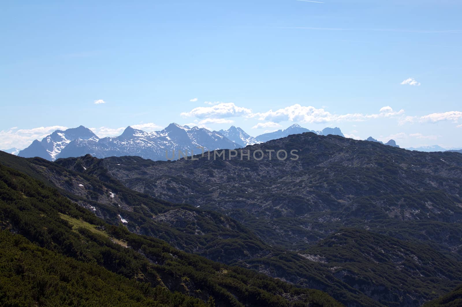 The Alpine mountains of Austria below the warm sun of summer