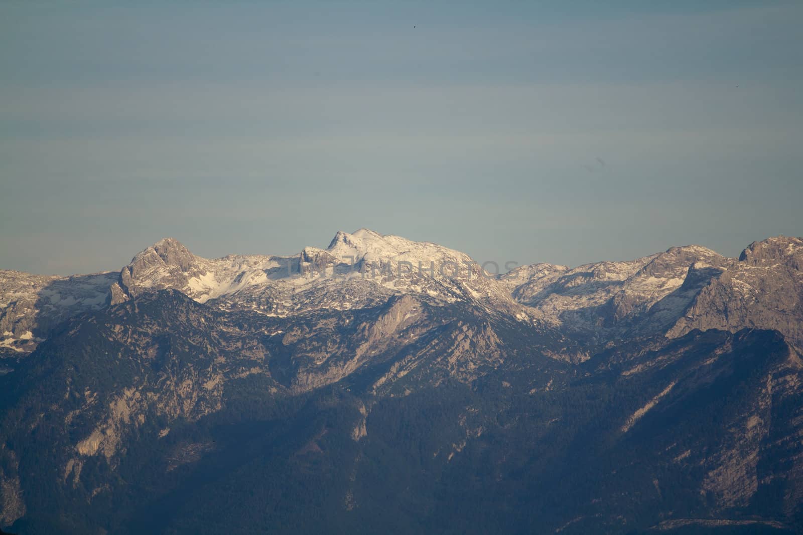 The Alpine mountains of Austria below the warm sun of summer