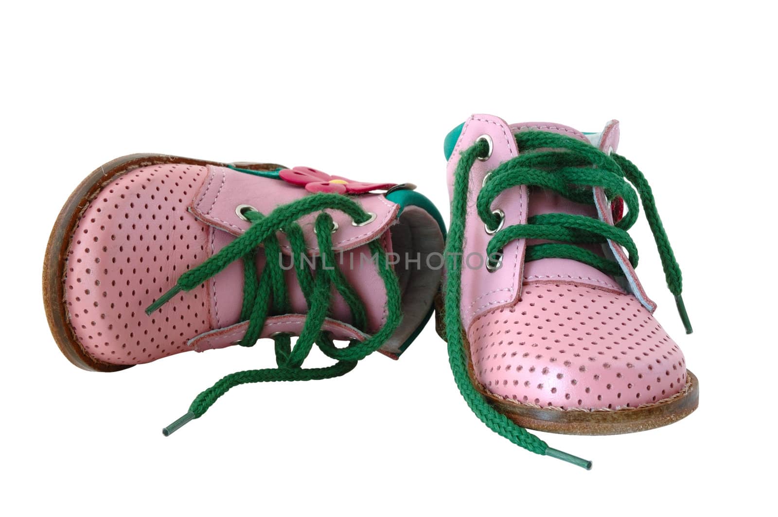 Pink leather baby's boots with green shoe-laces.