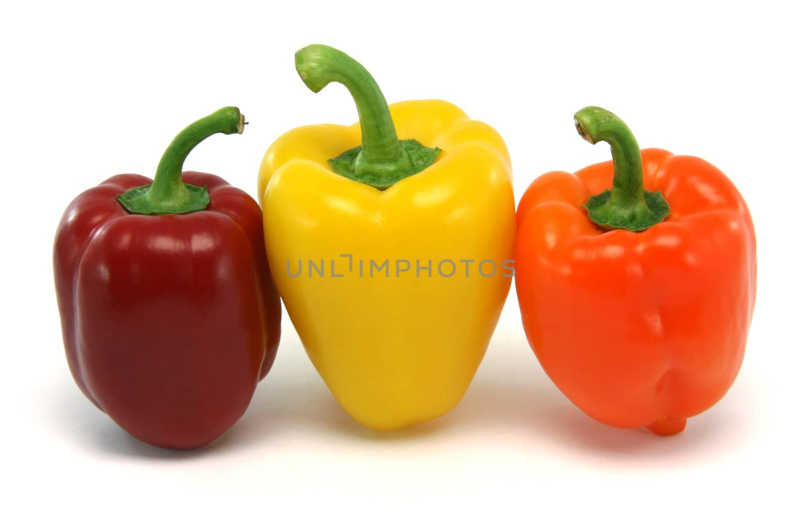 three color peppers from above isolated on white background food and vegetables concepts