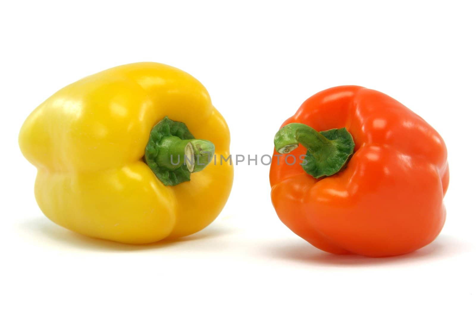 yellow and orange color  peppe closeup isolated on white background food and vegetables concepts