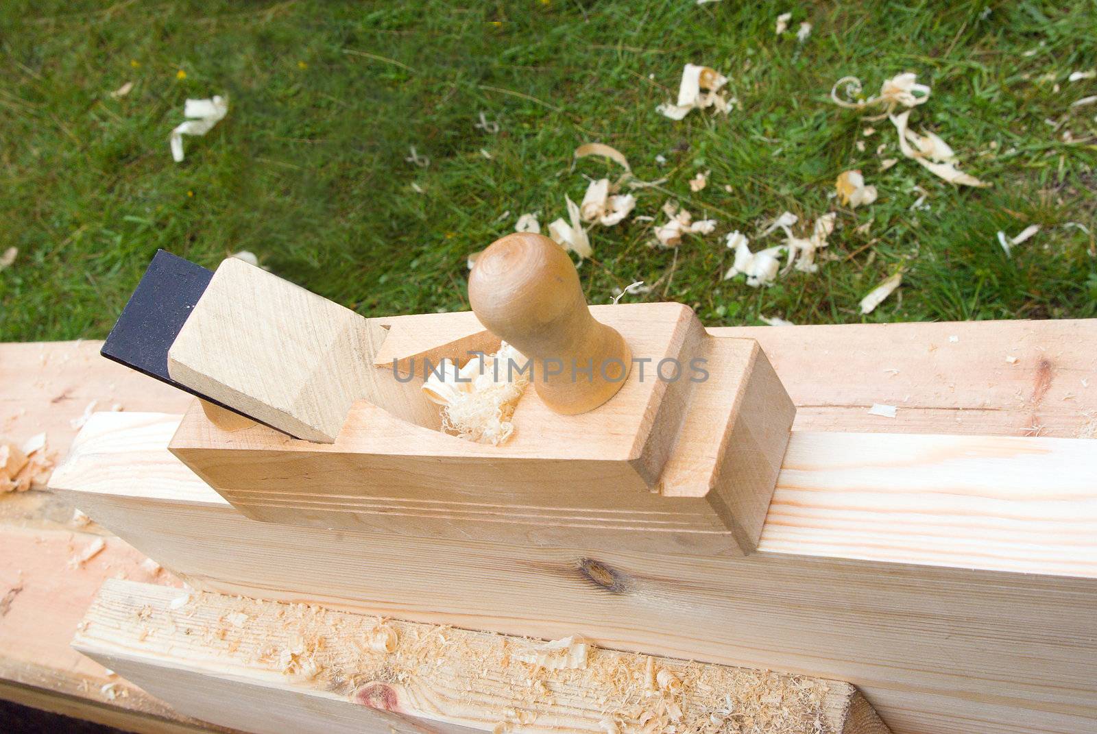 The still life photo of old plane and planed boards