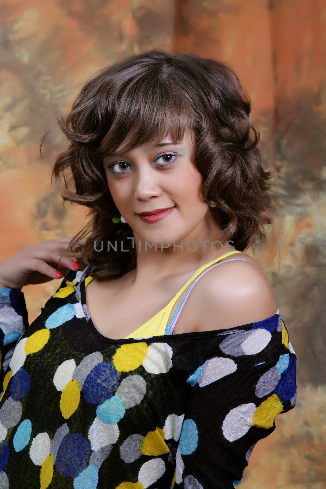 Portrait of the beautiful young woman in studio