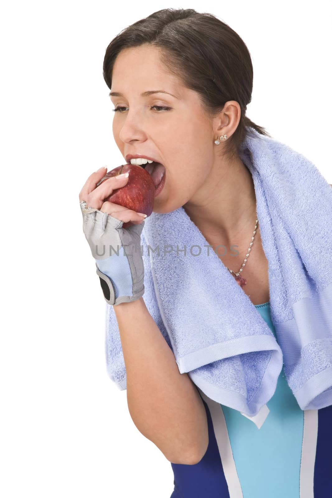 Young woman bitting a red apple.Shot with Canon 70-200mm f/2.8L IS USM