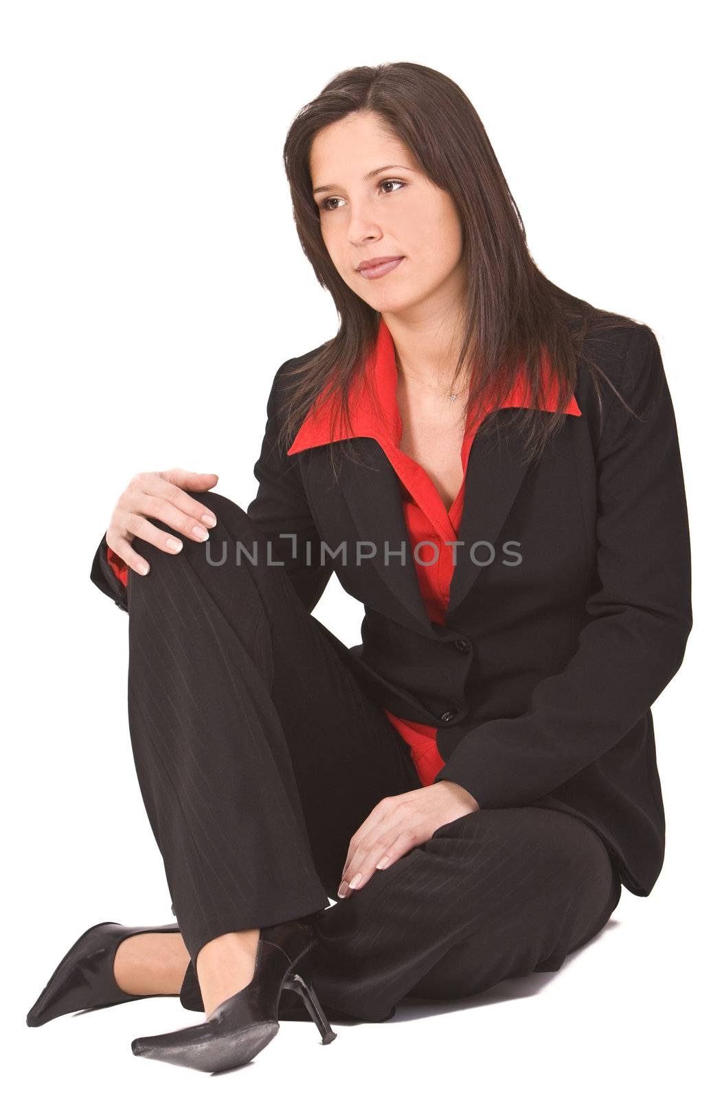 Beautiful young woman sitting on the floor.