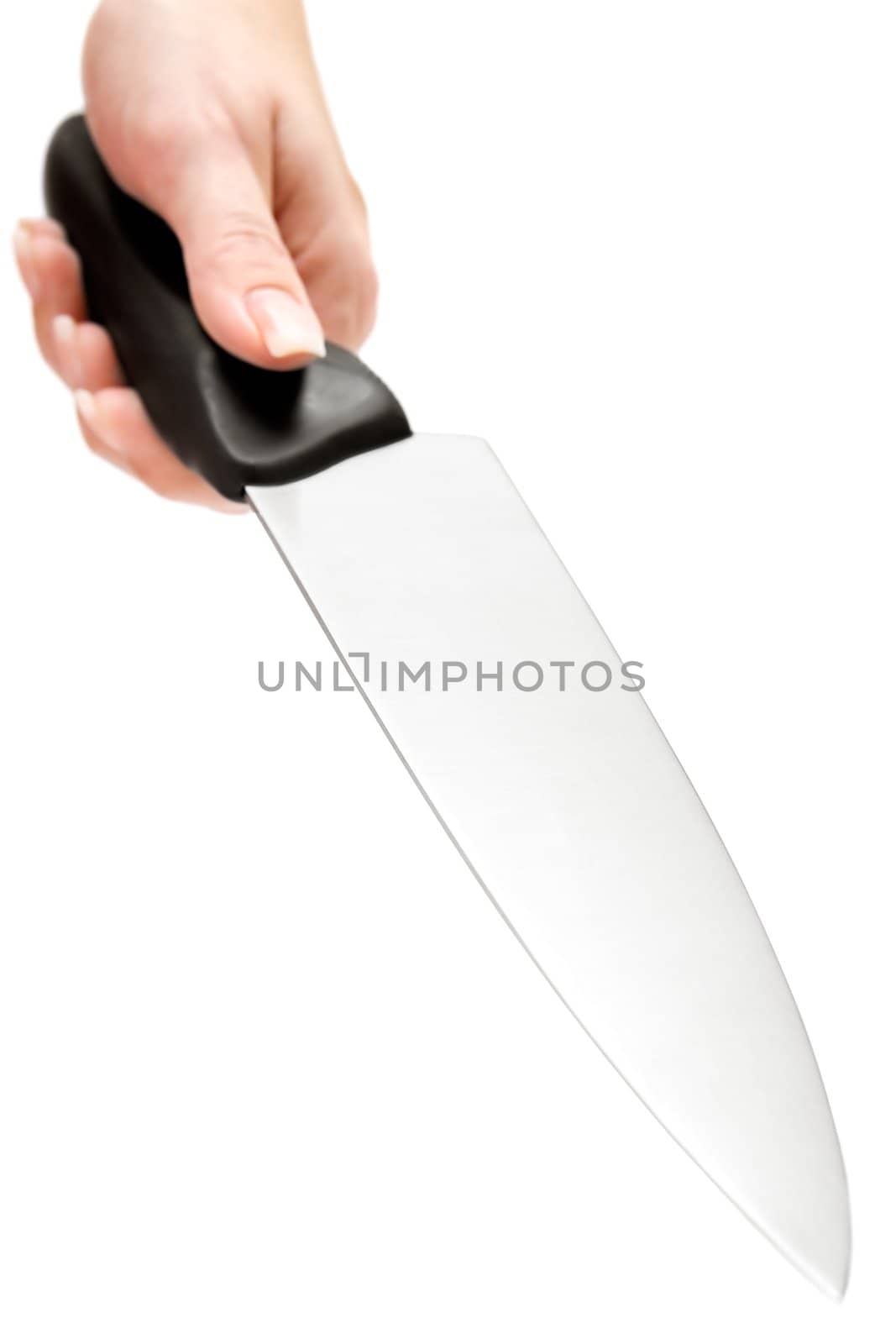 Female hand with a big kitchen knife. Isolated on a white background. Shallow depth of field.