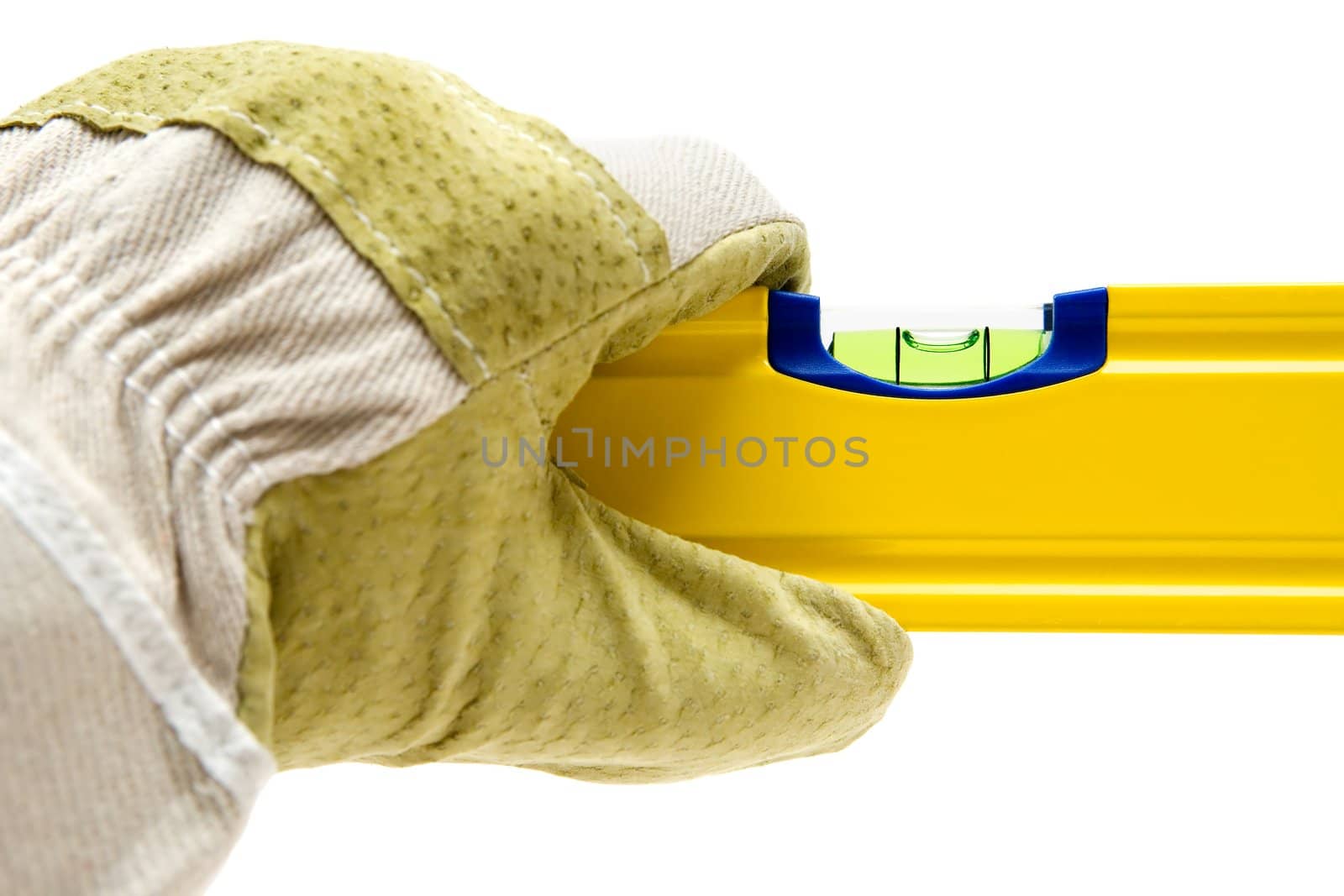 Gloved hand holding a spirit level. Isolated on a white background.