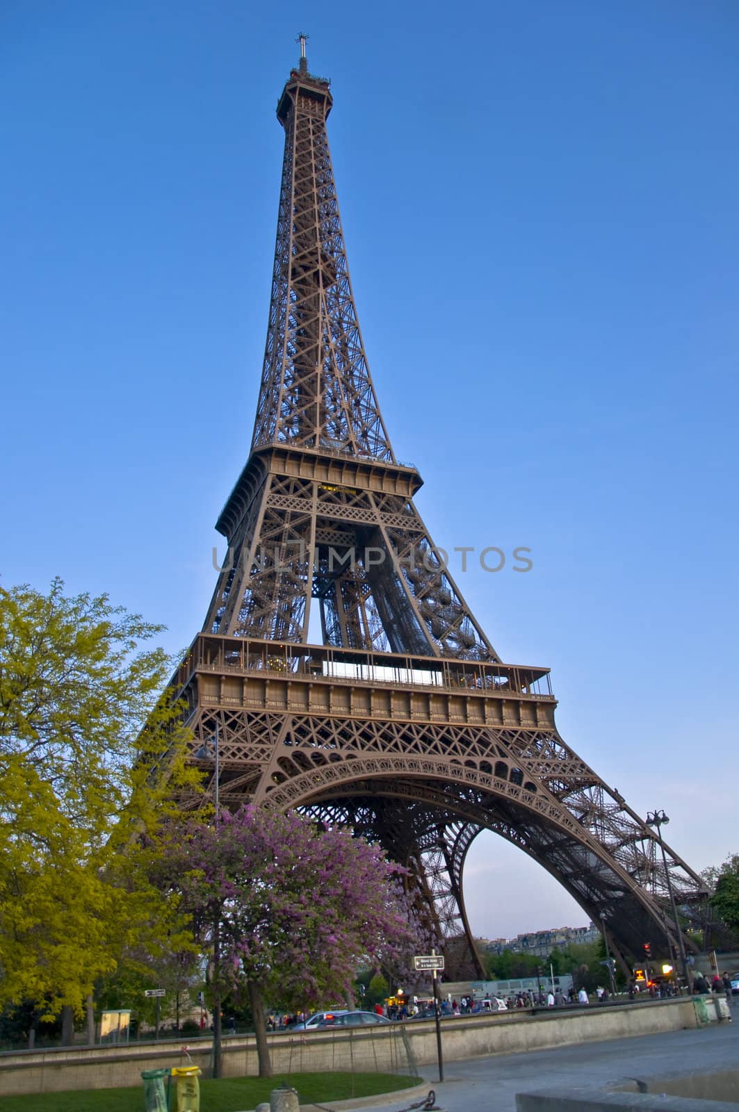 Eiffel Tower at afternoont. A symbol of Paris against the dark sky.