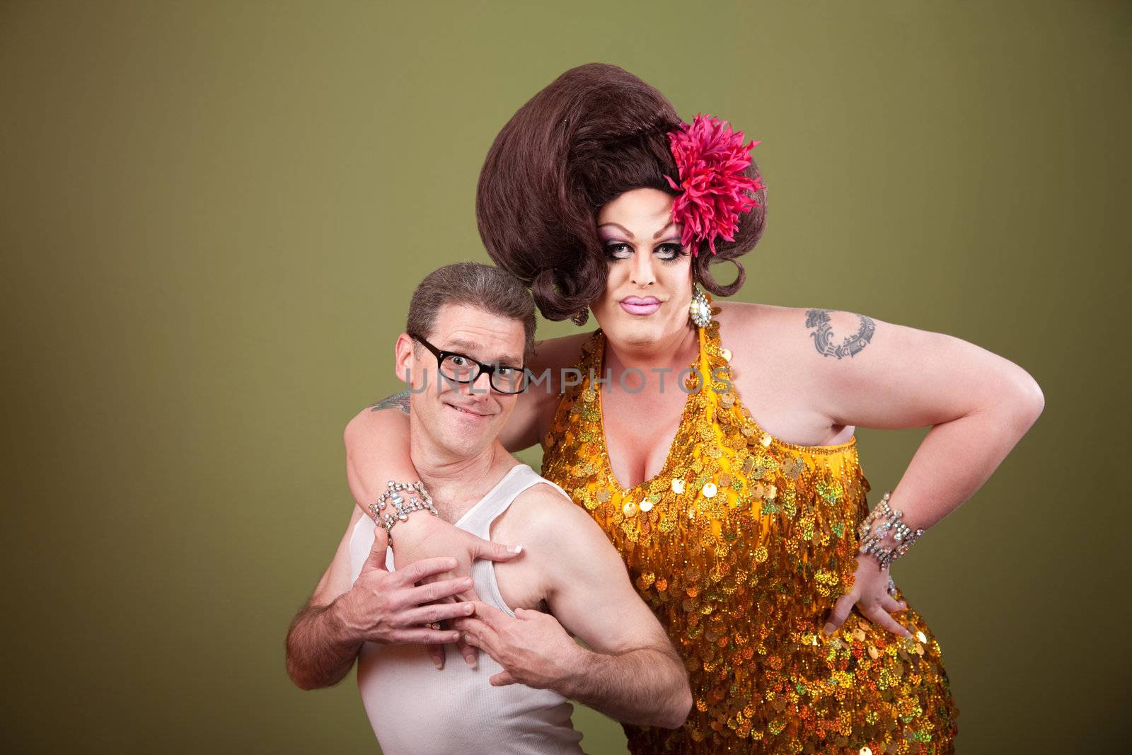 Large woman holding nerd in t-shirt on green background