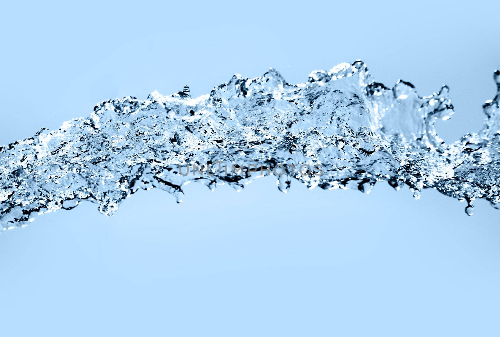 Water splash. Over blue background.