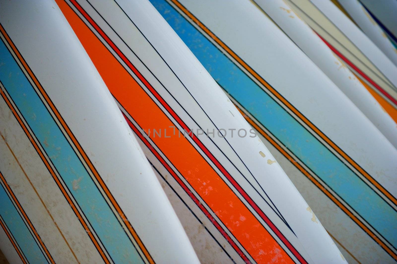 Row of Striped Surfboards by pixelsnap