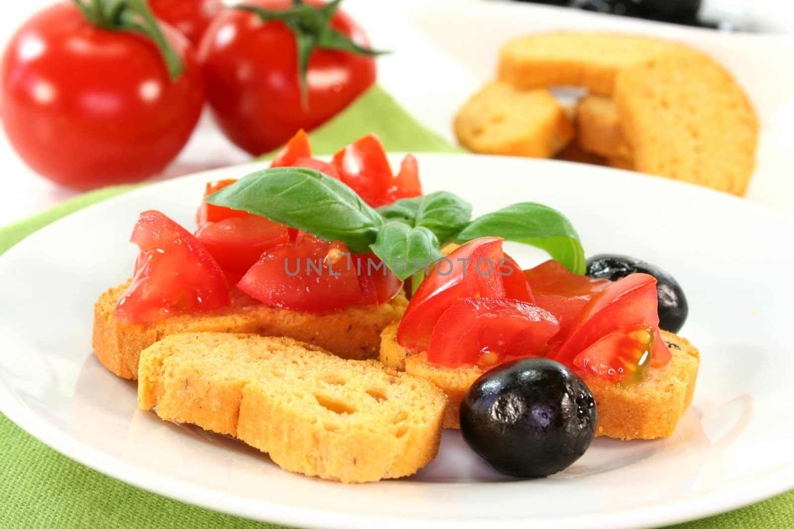 Bruschetta with tomatoes, olives and basil
