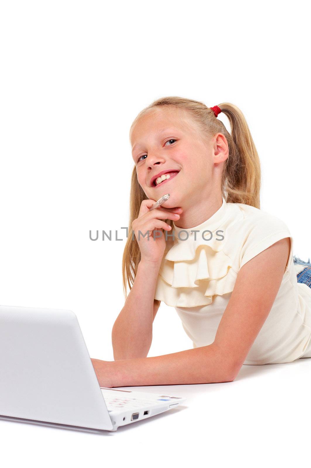 Happy little girl with laptop on white background isolated