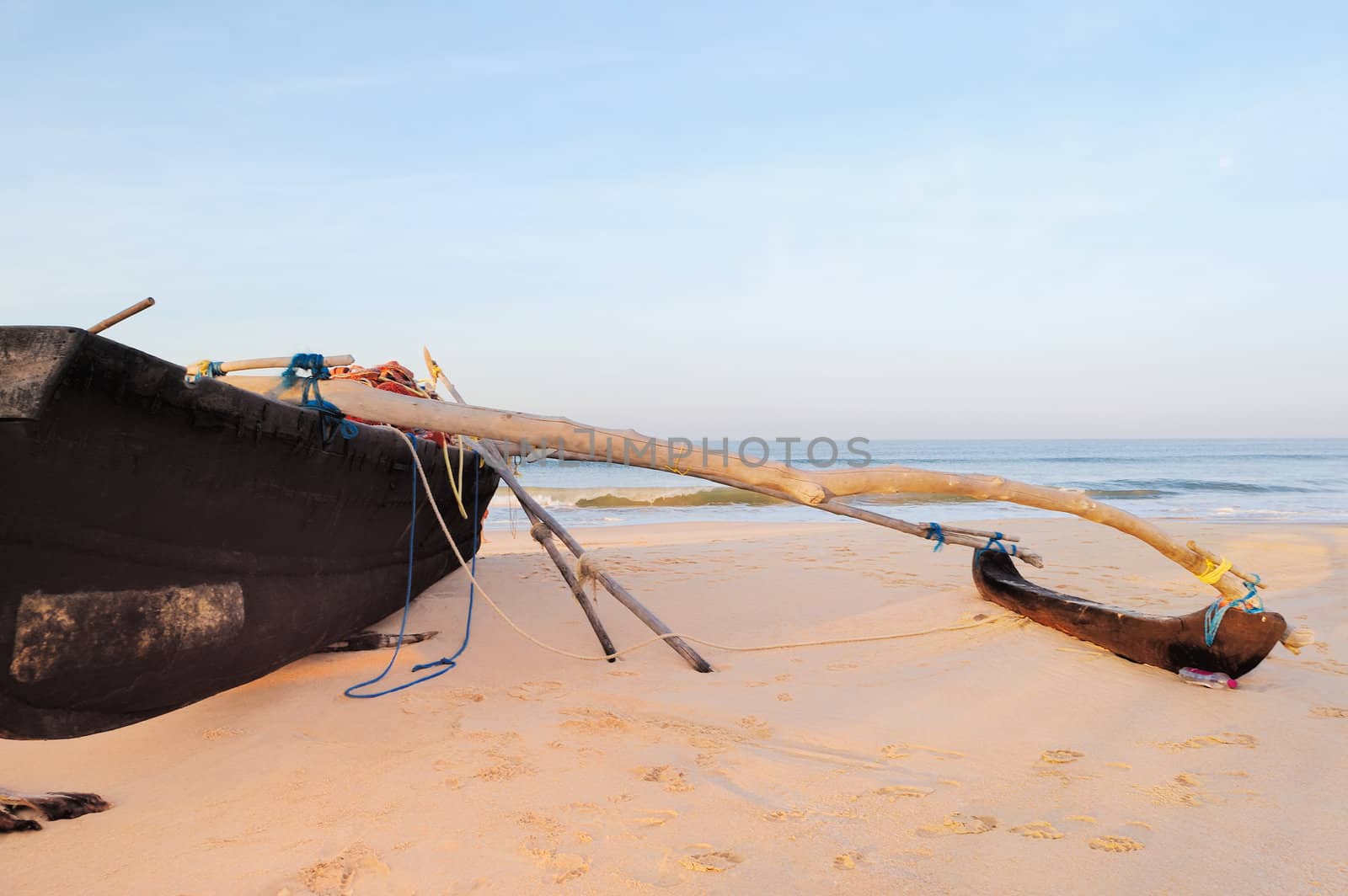 Old fishing boat on the sandy shore