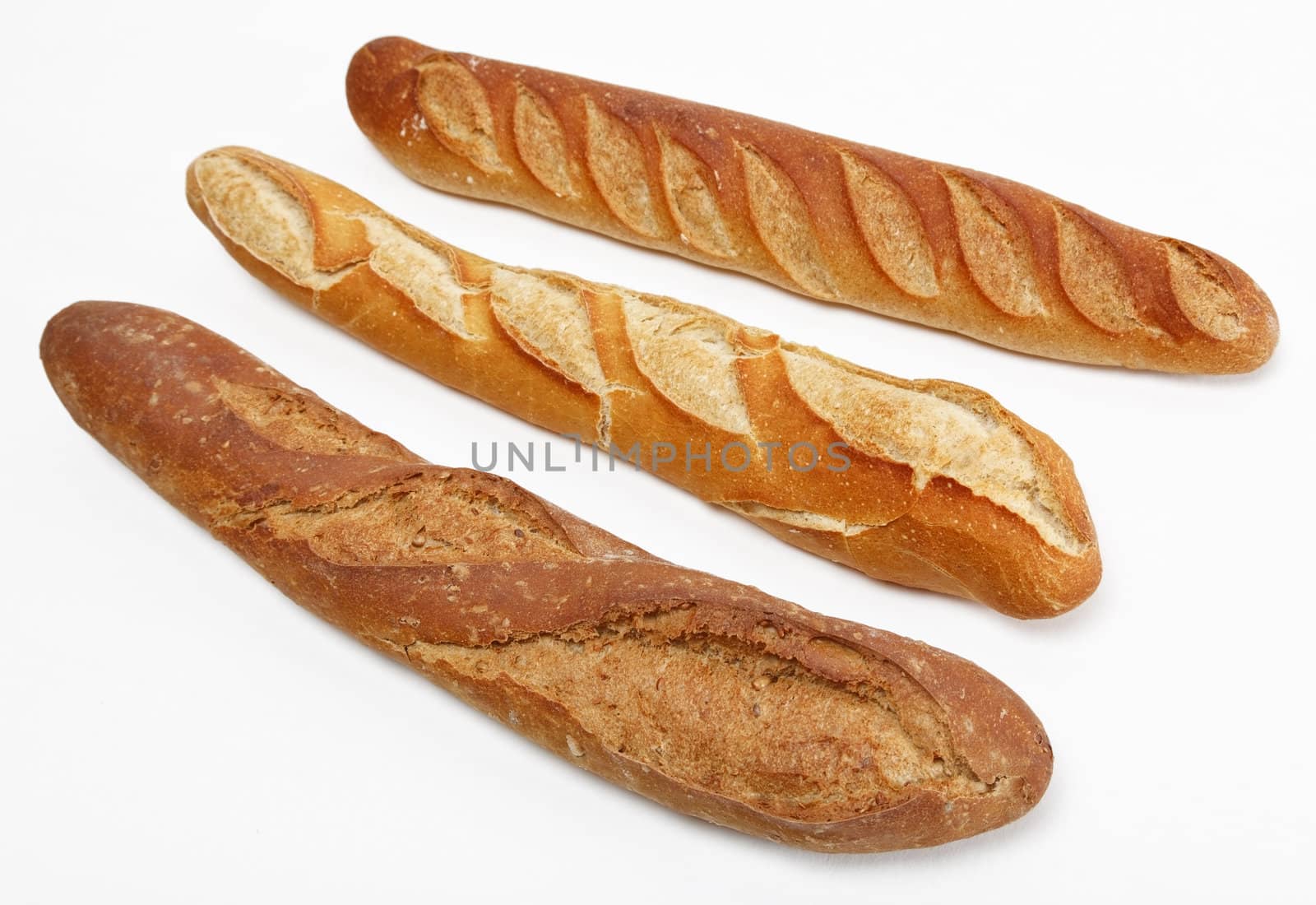 Three different French baguettes against a white background.