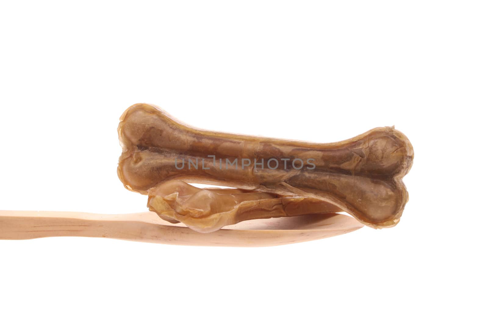 Bones simply offered on a wooden spoon isolated on a white background 