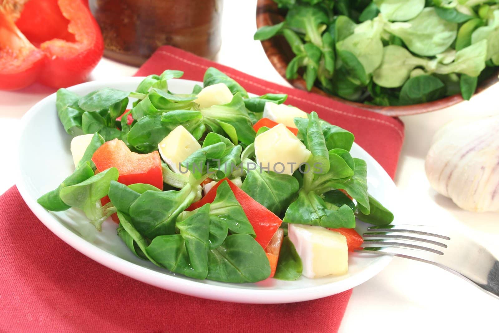 mixed salad with Corn salad, peppers and goat cheese