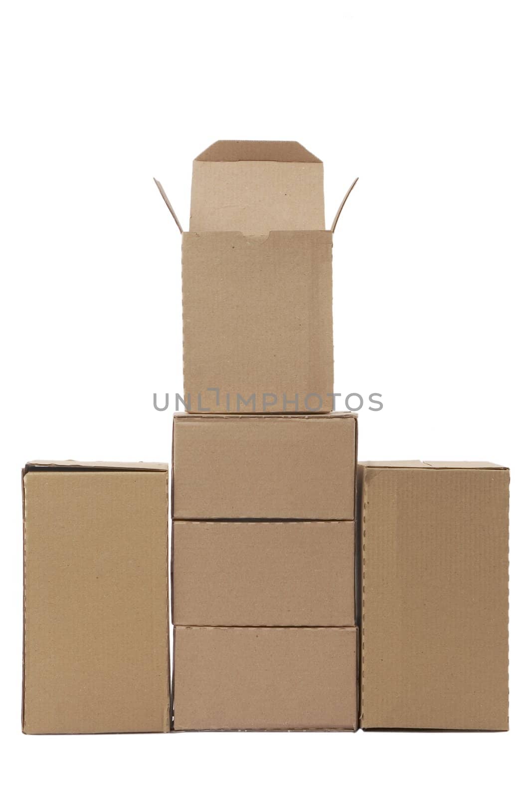 Brown cardboard boxes arranged in stack on white background