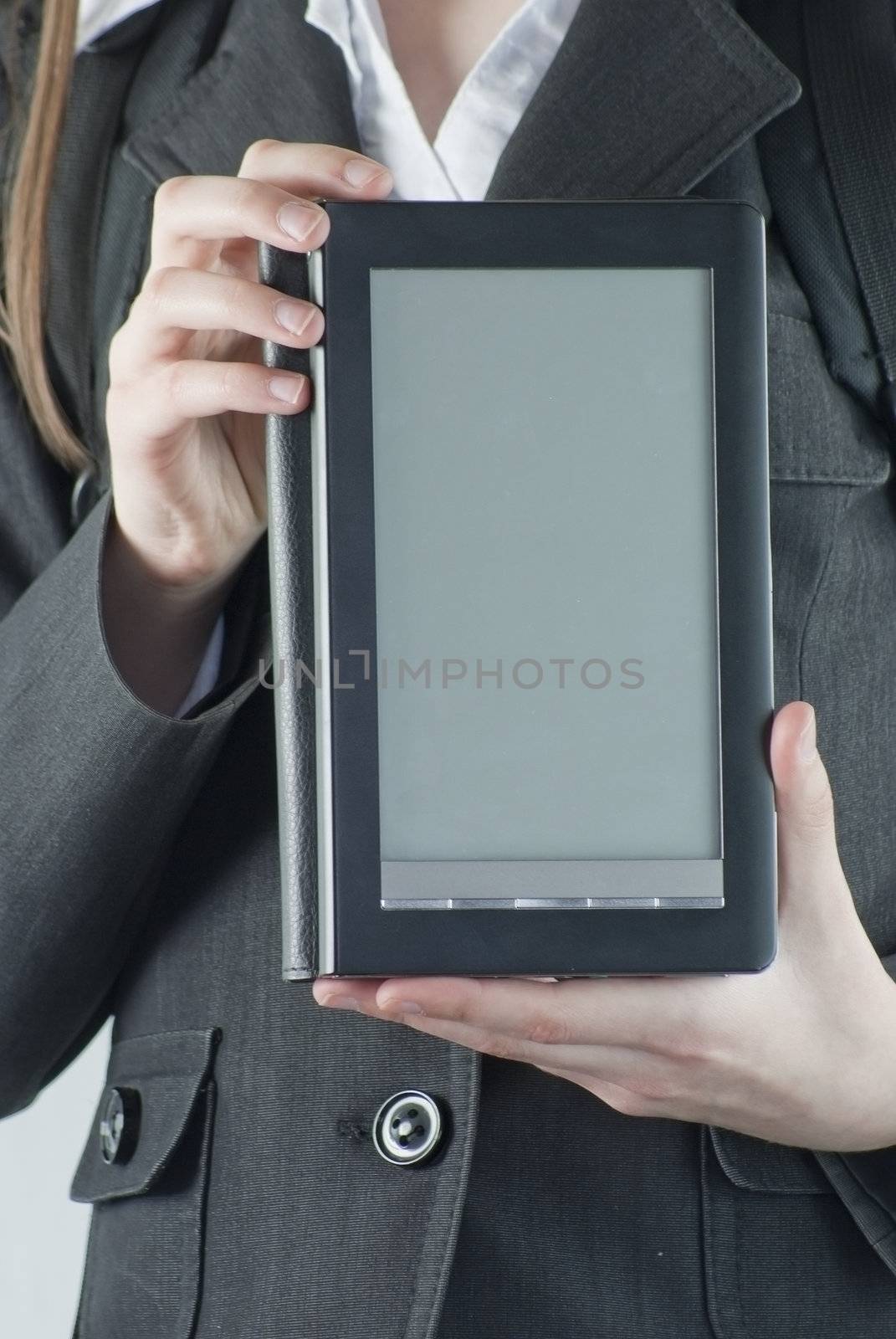 Girl holding a electronic book reader by AndreyKr