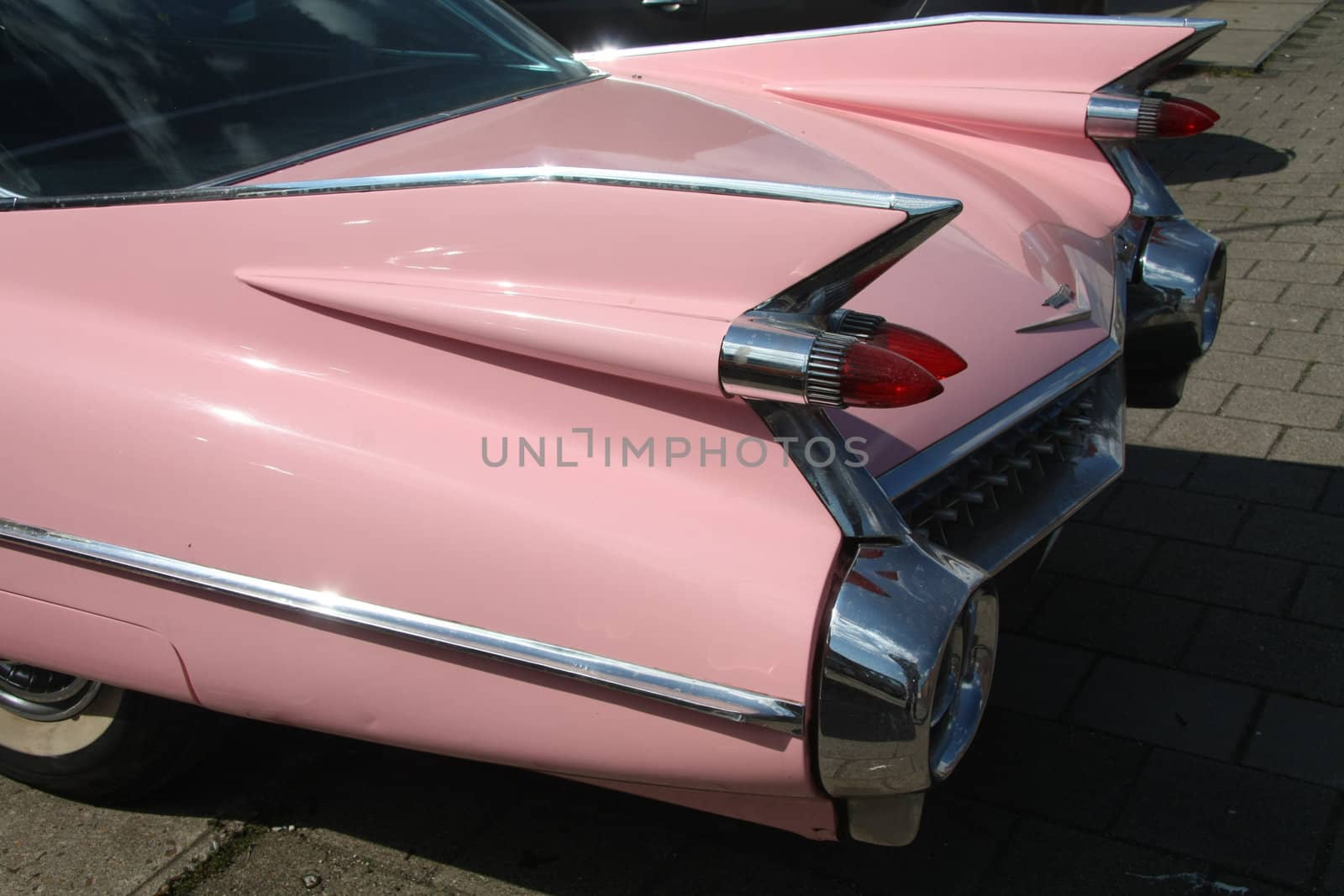 Detail of a pink vintage american car, 