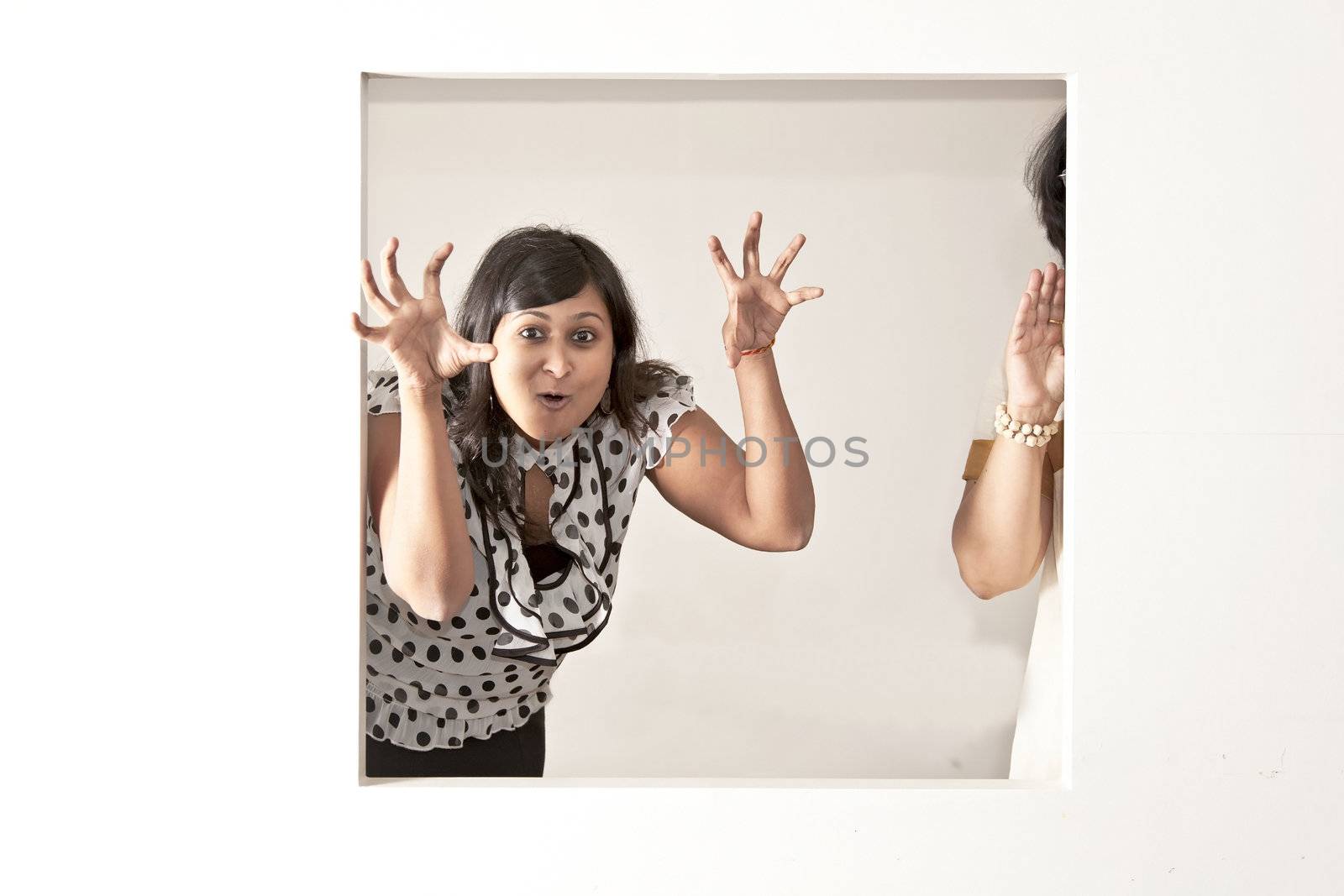 Indian lady with polka top scary on a light background