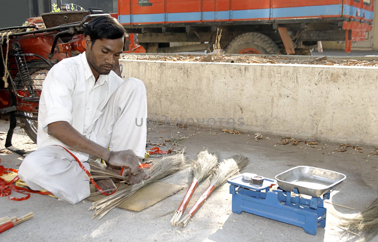 mobile tradesman traveling village to village making brushes sweeper Jaaroo in Gujarat india