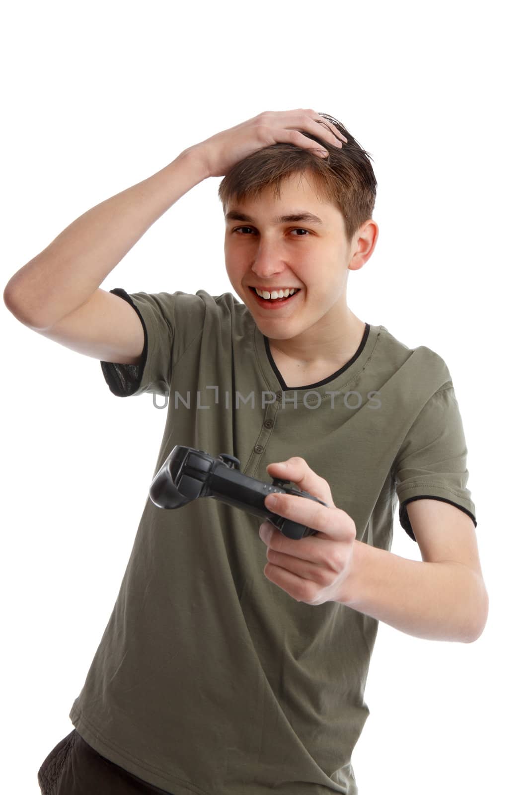 Happy boy at leisure, holding a wireless game controller.  White background.